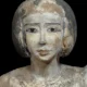 Statuette of a woman carrying an offering. Musée du Louvre. E 10781