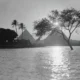 A view of the Pyramids of Giza along the Nile River at sunset. Photograph, 1934.