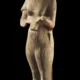 Sandstone painted statue of Nefertiti seemingly holding offering tray