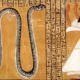 Tomb painting of Inherkhau worshiping the serpent god Sata
