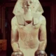 Kneeling statue of Hatshepsut making an offering of Nu vases
